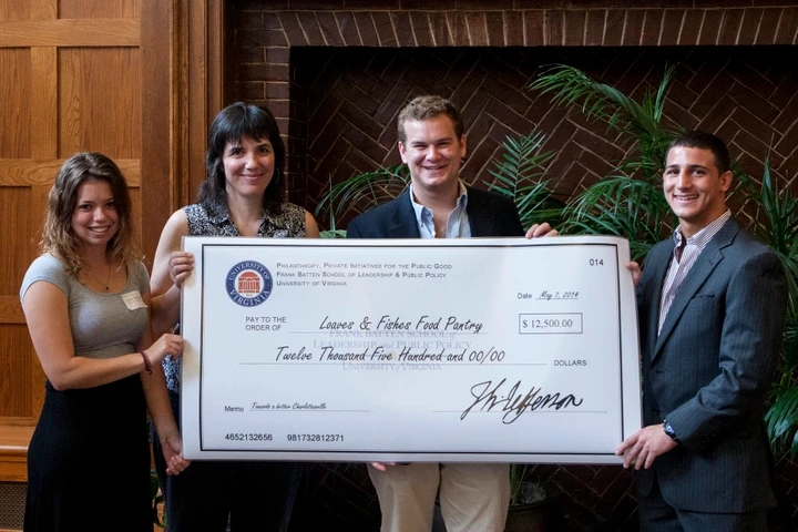 Batten Students holding up a large check